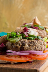 Hamburger made with lamb meat. Lamb burger. Classic traditional greek variation of the classic american burger tradition. seasoned lamb meat with feta cheese, red onion and greek mayo. 