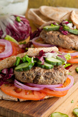 Hamburger made with lamb meat. Lamb burger. Classic traditional greek variation of the classic american burger tradition. seasoned lamb meat with feta cheese, red onion and greek mayo. 