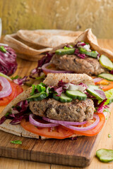 Hamburger made with lamb meat. Lamb burger. Classic traditional greek variation of the classic american burger tradition. seasoned lamb meat with feta cheese, red onion and greek mayo. 