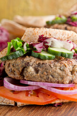 Hamburger made with lamb meat. Lamb burger. Classic traditional greek variation of the classic american burger tradition. seasoned lamb meat with feta cheese, red onion and greek mayo. 