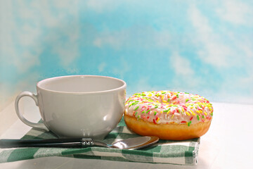 Traditional donuts with pink icing as dessert on a light background.  Delicious donuts.