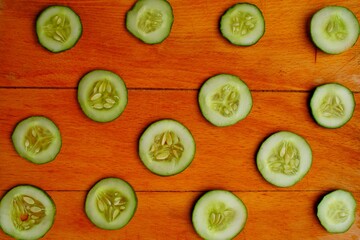 sliced cucumber on the wooden background