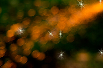 Abstract background of golden bokeh on a green background