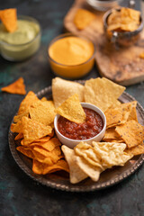 Snacks potato chips with salsa and dip, top view, snacks for relaxation