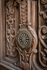 Detail of a wooden door at an old apartment building in Havana