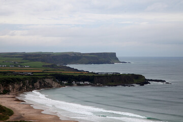 Beautiful coastline of Northern Ireland, featuring clifs, waves and water