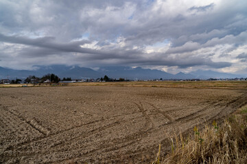 Fototapeta na wymiar Winter Plowed field after harvest in Nagano prefecture, Japan.