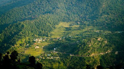 Scenic North Indian villages in Himalaya, surrounded by hills, dense trees, and farmland. Sari village, Rudraprayag, Uttarakhand