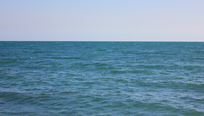 Fototapeta na wymiar Blue wavy open sea 