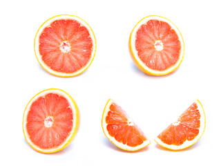 Naklejka na ściany i meble Close up of a sliced fresh grapefruit ,Slice of red grapefruit isolated on white background