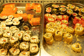 different types of sushi in a tray