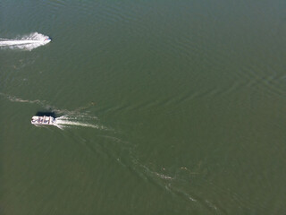 Naklejka premium Floating boat on the river, aerial view