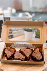 chocolate brownies in paper boxes ready for take away and delivery