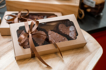 chocolate brownies in paper boxes ready for take away and delivery