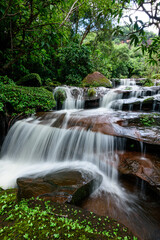 Fototapeta na wymiar Beautiful waterfalls in the green forest in the forest area of ​​Phu Lanka National Park, Bueng Kan Province, Thailand