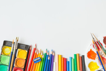 Top view of Colorful Watercolor palette, paintbrush, colored pencils, ruler and drawing equipment ...