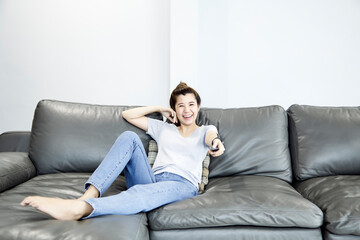 Fototapeta premium Woman at home watching tv