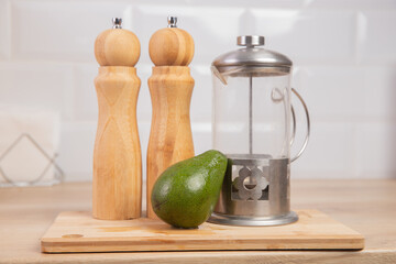 Scandinavian style, manual wooden mill for salt and pepper stand on background of kitchen