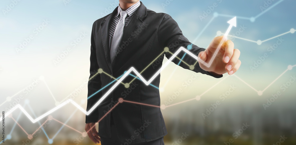 Wall mural hand touching graphs of financial indicator and accounting market economy analysis chart