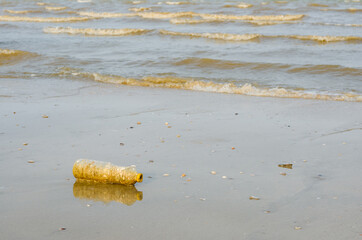 Plastice Bottle Waste On the Beach Is a Pollution Reason of Climate Change.