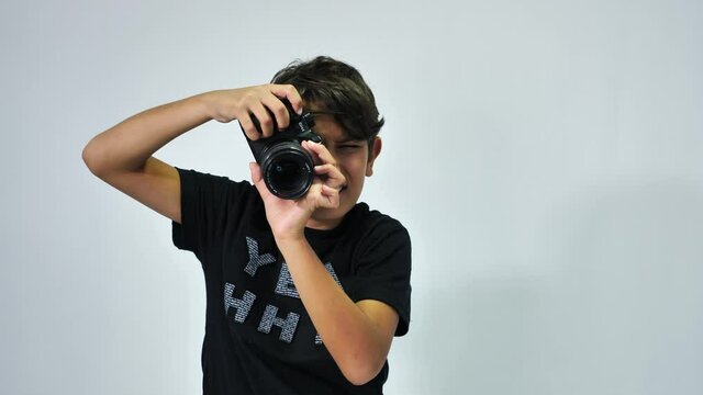 a child playing with a camera and taking photos