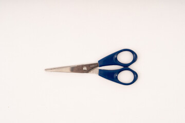 scissor with plastic handle on white background.