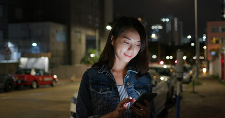 Woman use of mobile phone at street