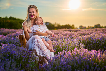 Young mother and her son in a lavender field