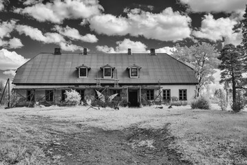 surreal landscape, old houses, infrared photo of the amazing nature of the snowy tree