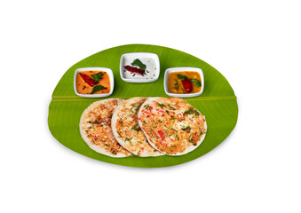 south Indian breakfast set dosa, onion dosa ,with coconut chutney, red chutney, and sambar served...