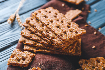 Rye crispbreads on wooden table, closeup
