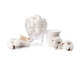 Cotton balls with pads and sticks on white background