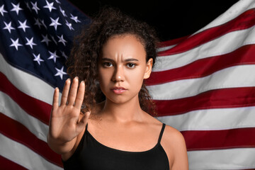 African-American woman against USA flag. Stop racism