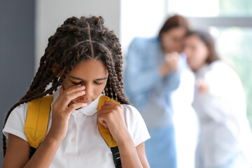 Pupils bullying African-American girl at school. Stop racism