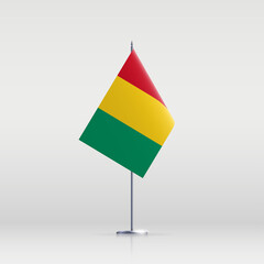 Guinea flag state symbol isolated on background national banner. Greeting card National Independence Day of the Republic of Guinea. Illustration banner with realistic state flag.