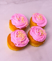 Beautiful pink cupcakes, cakes, on a light background, close-up