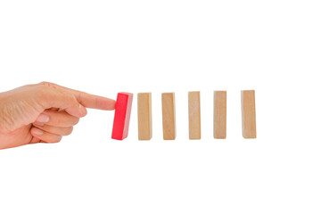 Hand and falling pieces of wodden blocks on white background with clipping path