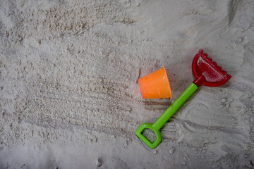 Fototapeta na wymiar Children's toys on the sand beach