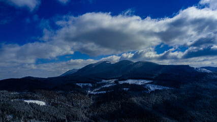 Carpathian mountains mountain range pine forests coniferous mountain tops winter snow aerial photography