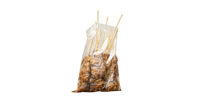 Grilled pork in disposable plastic bag isolated with clipping path