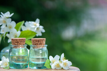 Obraz na płótnie Canvas Essential Jasmine oil. Bioproduct, organic cosmetics. Perfumery, cosmetology, aromatherapy