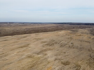 Agricultural land, aerial view. Landscape. Arable fields in the spring.