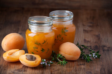 Apricot jam with thyme  in glass jars