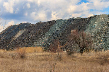 View of slag heaps of iron ore quarry. Mining industry