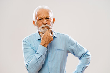 Portrait of pensive and serious senior man.