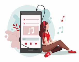 Young girl wearing headphones. Girl listening to music with mp3 player and smartphone.