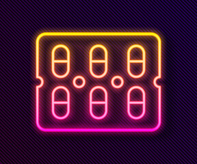 Glowing neon line Pills in blister pack icon isolated on black background. Medical drug package for tablet, vitamin, antibiotic, aspirin. Vector Illustration.