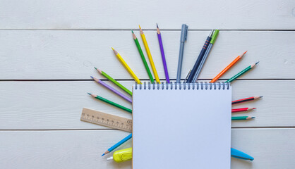 Back to school concept school office supplies on a white wooden background