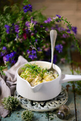 squash stew with dill  in  ceramic pan. style rustic