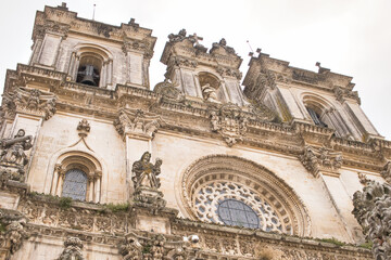 Fototapeta premium The facade of Monastery of Santa Maria d'Alcobaca (Alcobaca monastery) in Portugal, founded in Middle Ages